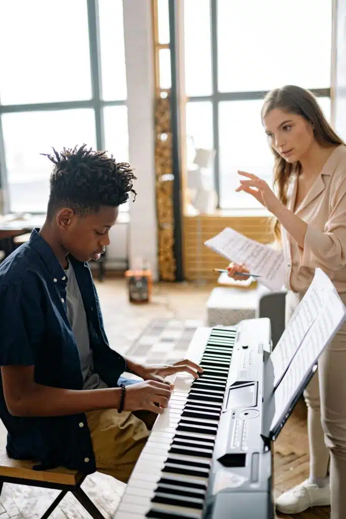 Boy learning piano