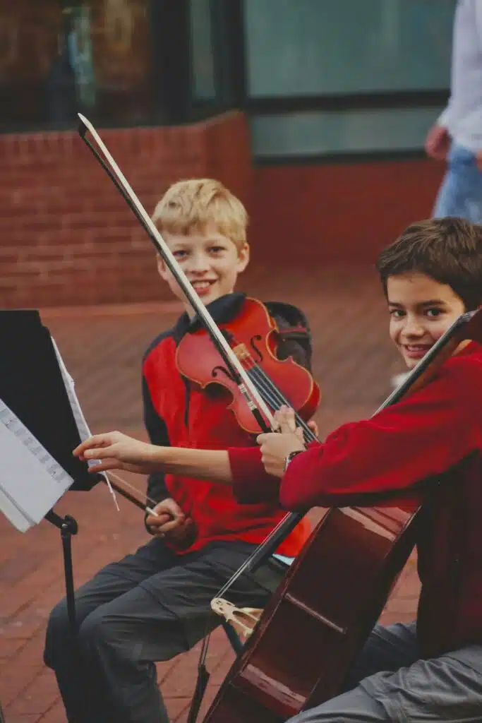 Boys learning to play instruments